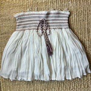 White flowy mini skirt w/ embroidered waist band and tie